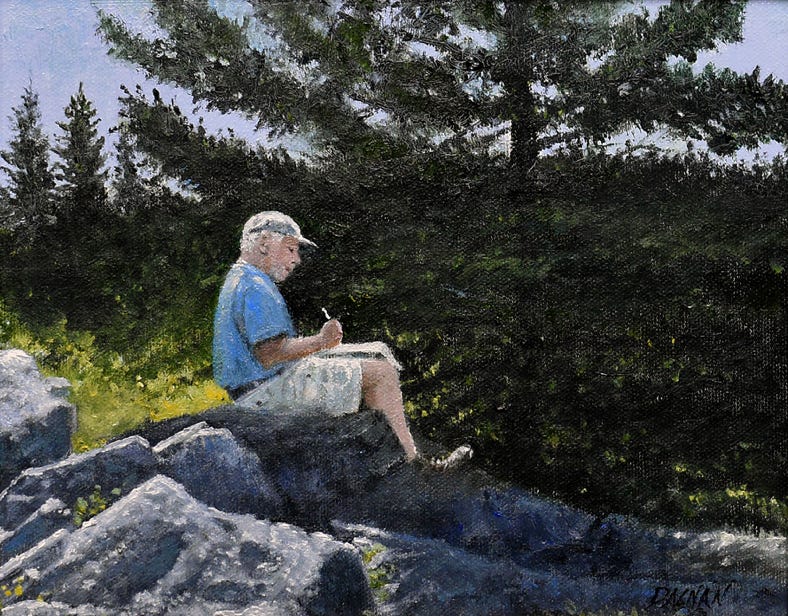 Artist setting on a rock sketching.